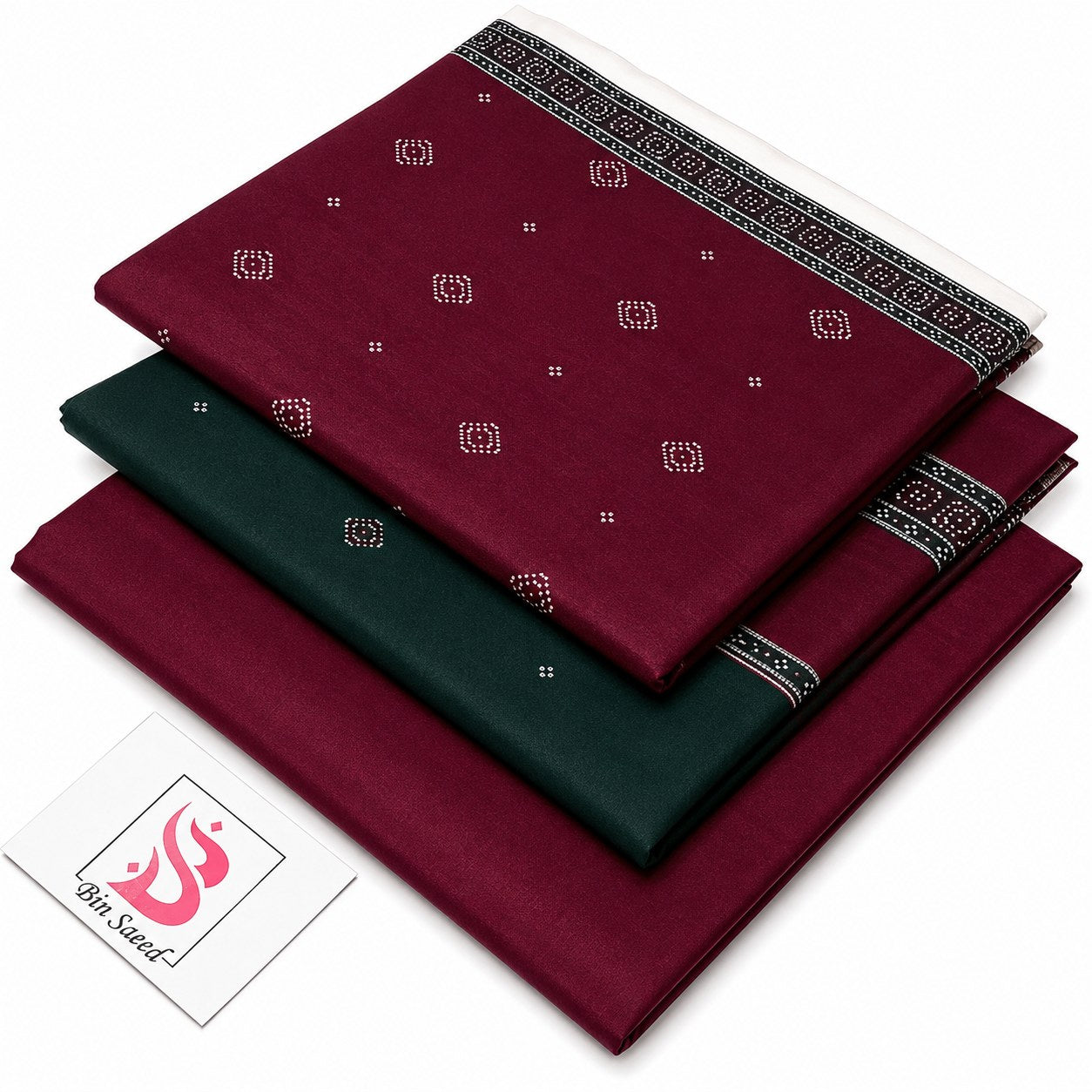 Three folded sarees stacked diagonally on a white background, with a small 'Sir Swastik' brand card in the bottom left. The top and bottom sarees are deep maroon with small white motifs and a black patterned border, while the middle saree is dark green with a similar border.