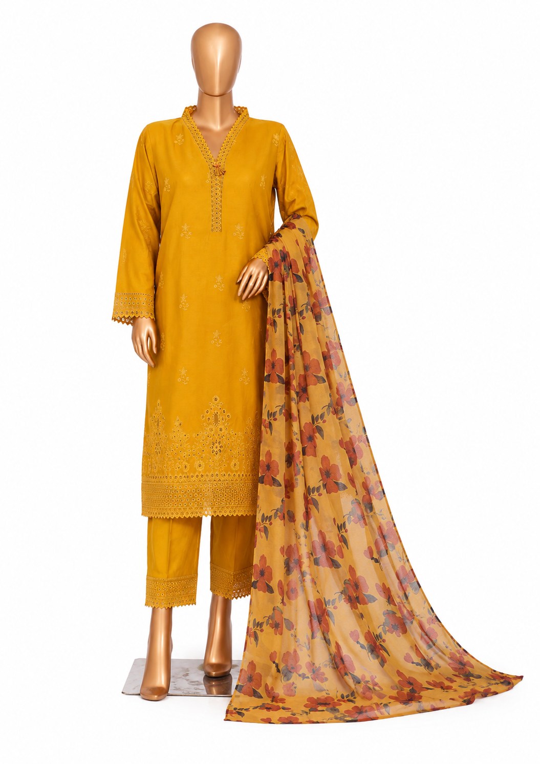 A mustard yellow three-piece suit set displayed on a mannequin, featuring a long-sleeve embroidered kurta, matching trousers, and a floral printed dupatta.