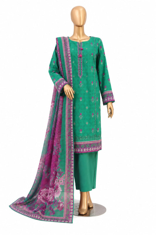 A three-piece green ethnic suit displayed on a mannequin, featuring a green kurta with pink and green floral embroidery, matching green trousers, and a sheer green dupatta with a pink floral print and patterned border.