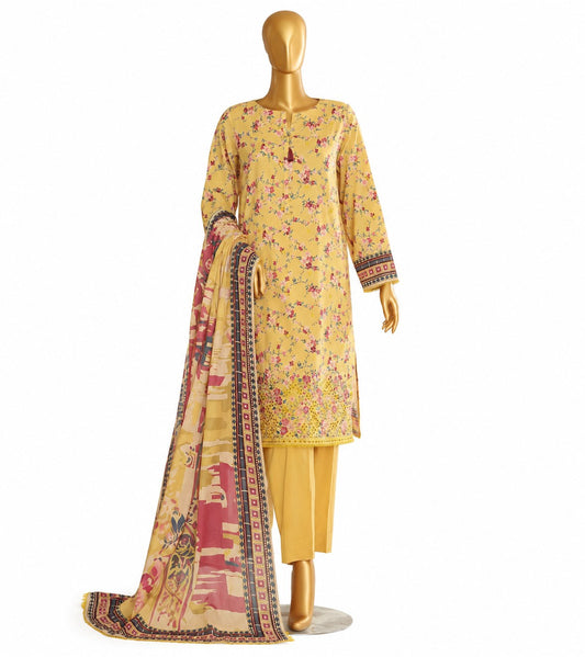 A yellow three-piece ethnic suit set displayed on a gold mannequin, featuring a floral printed kurta, matching trousers, and a patterned dupatta with a multicolor border.