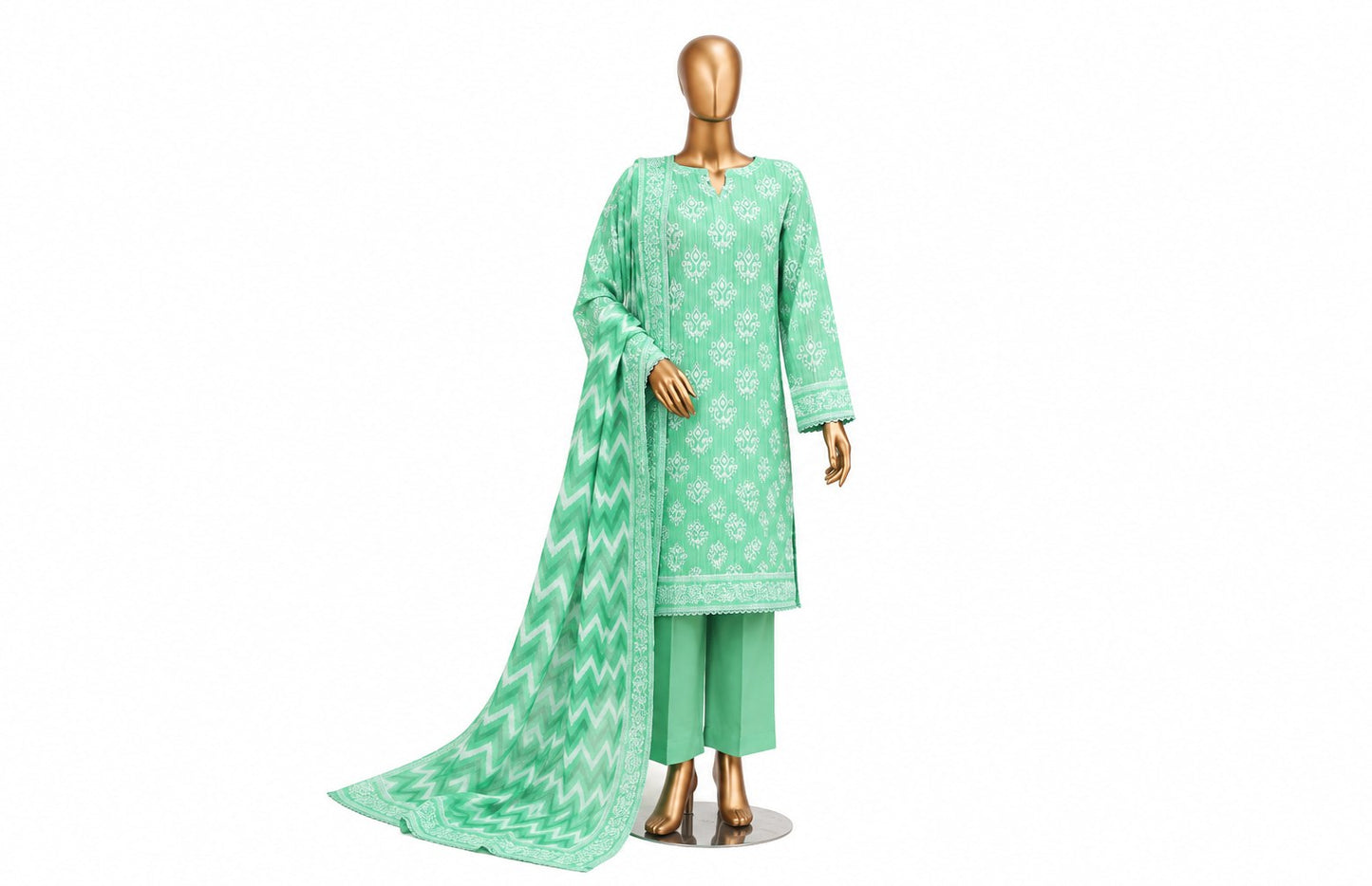 A mint green three-piece traditional outfit displayed on a gold mannequin against a plain white background. The set includes a long-sleeve kurta with white floral prints, matching pants, and a draped dupatta with a white chevron pattern and border.