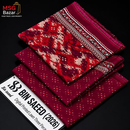 Three folded pieces of printed lawn fabric from MSG Bazar displayed on a black background, featuring a red and cream geometric patterned piece on top, a solid deep red piece in the middle, and a dark red dotted piece on the bottom. A white promotional banner in the corner reads '3 BIN SALEED (2026) Digital Printed Lawn Three Piece'.