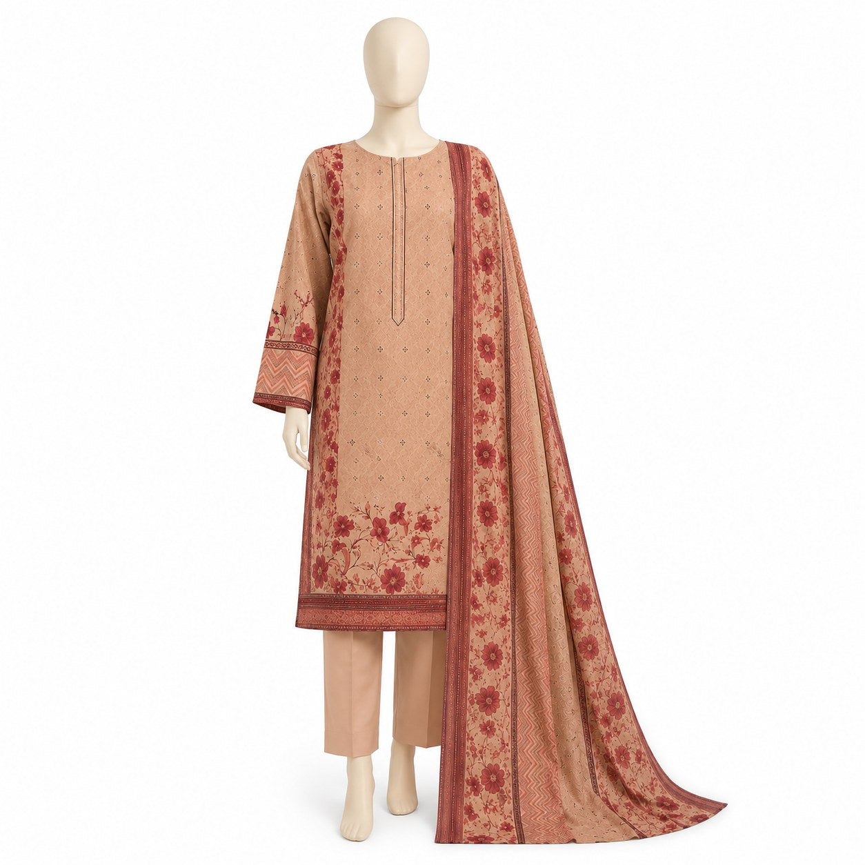 A beige and rust-colored three-piece salwar kameez suit displayed on a mannequin, featuring a printed kurta with floral motifs, matching trousers, and a coordinating dupatta.