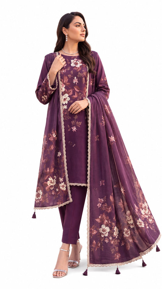 A woman modeling a traditional three-piece salwar kameez set in deep purple. The set features a printed floral long kurta, matching trousers, and a coordinating dupatta with beige border trim and tassels, shown against a plain white background.