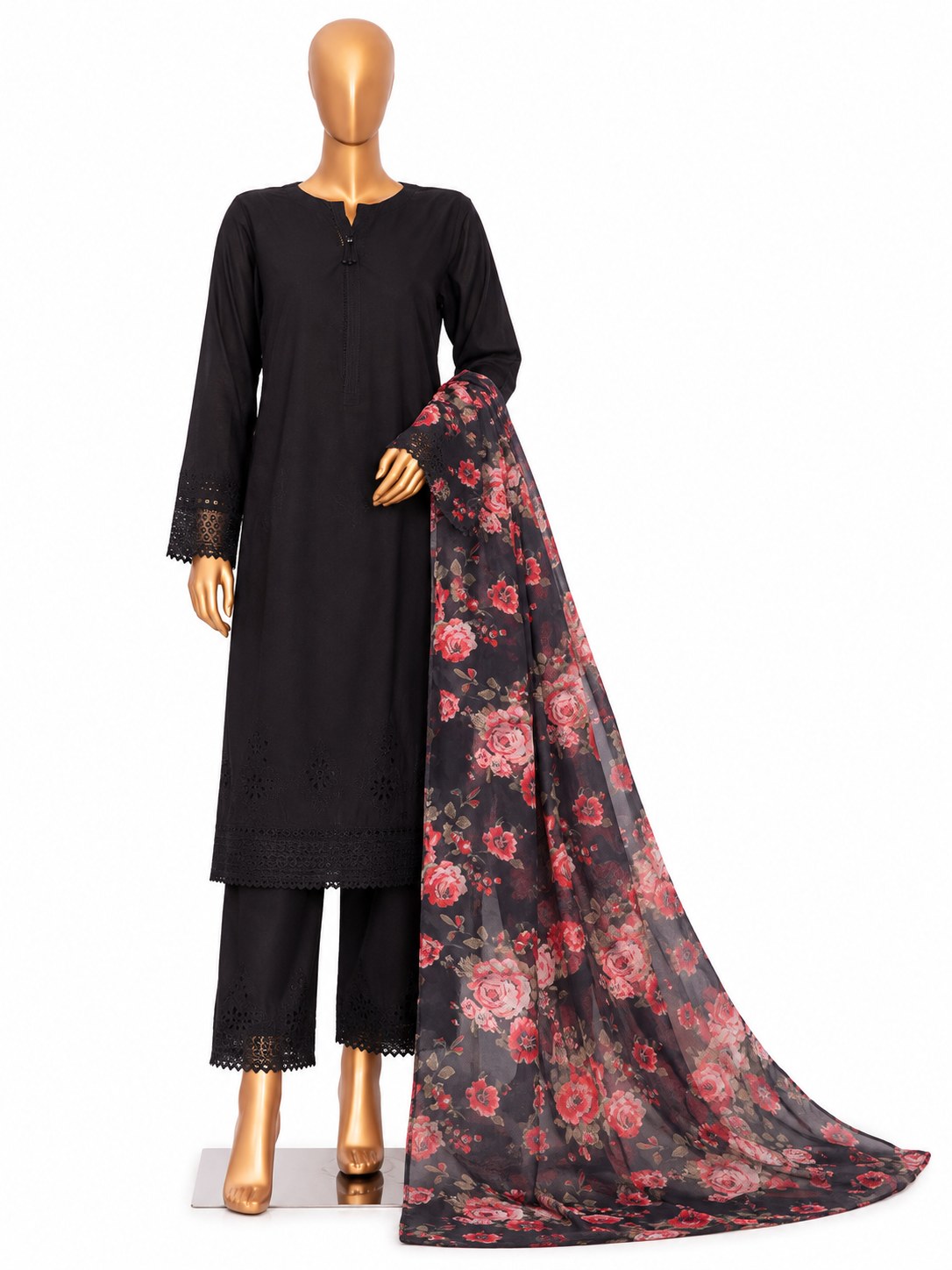 A black three-piece salwar kameez suit set displayed on a mannequin, featuring a long-sleeve embroidered kameez top, matching trousers with lace trim, and a sheer black dupatta with a red and pink floral pattern.