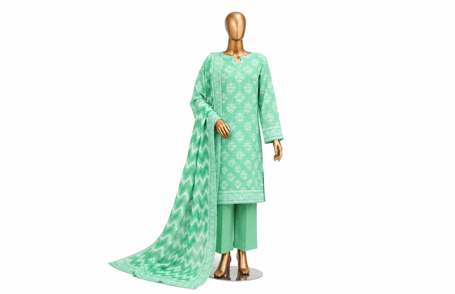 A mint green three-piece traditional outfit displayed on a gold mannequin against a plain white background. The set includes a long-sleeve kurta with white floral prints, matching pants, and a draped dupatta with a white chevron pattern and border.