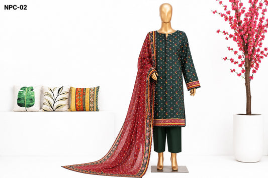 A 3-piece men's traditional outfit displayed on a mannequin, featuring a dark green kurta with gold and red patterns, dark green trousers, and a long red dupatta with gold and green borders. The image is set in a styled studio environment with decorative pillows and a potted plant.